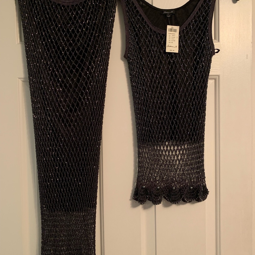 2 Piece Platinum Top and Skirt: Size Form fitting, New, Excellent condition